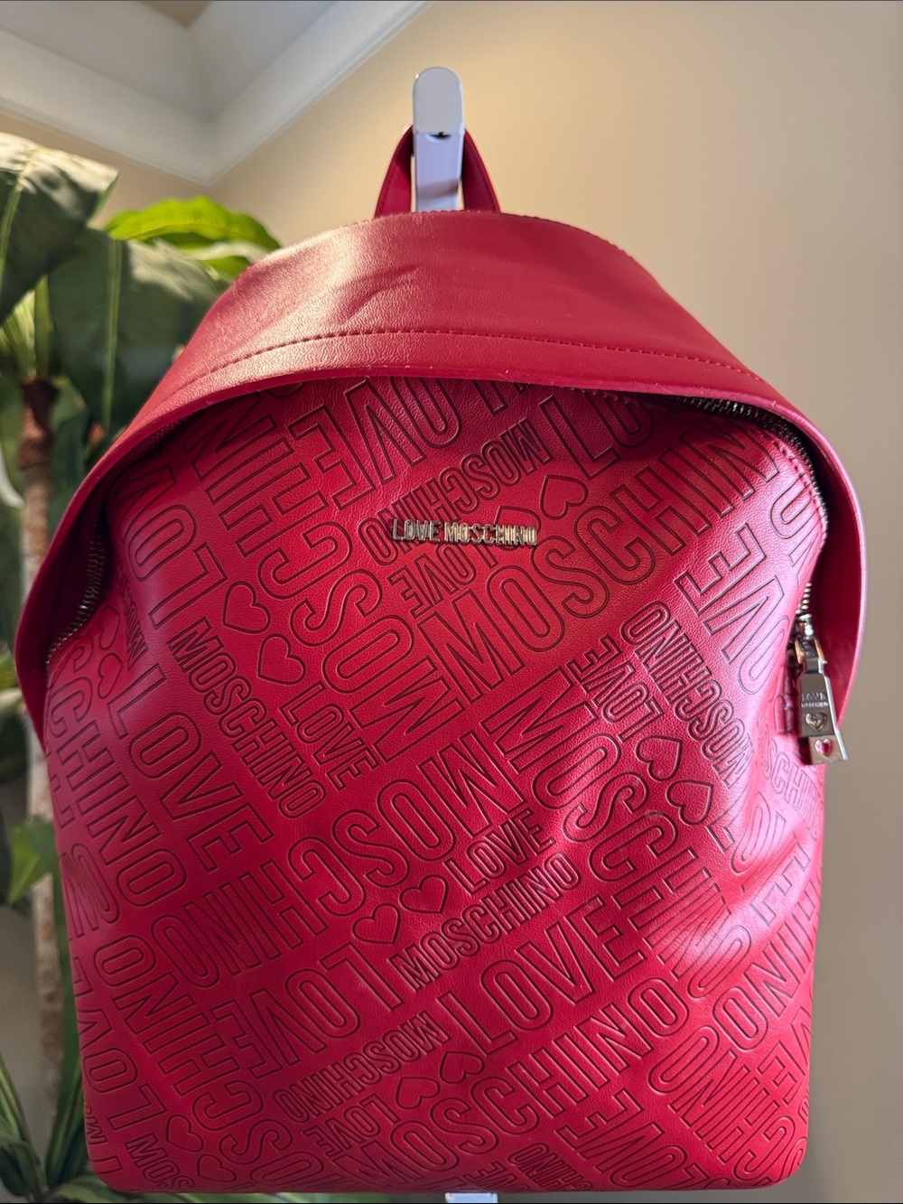 Love Moschino Red Logo-Patterned Backpack with Gold Hardware, inside is black.